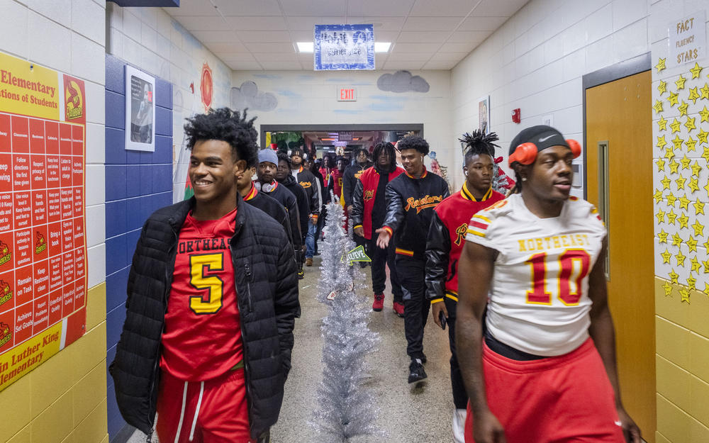 The Northeast High Raiders in a hall of Martin Luther King Jr. Elementary School Monday. 