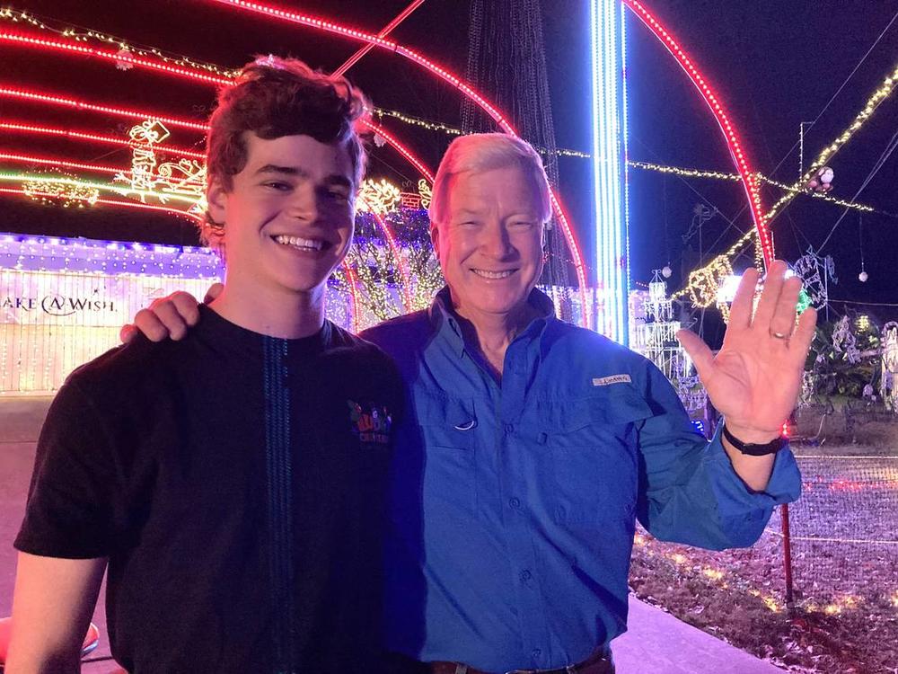 Foster Lambertus, left, and Jerry Ludy pose for a photo in 2021 at Ludy’s Christmas Lights Spectacular in Columbus. Courtesy of Foster Lambertus  