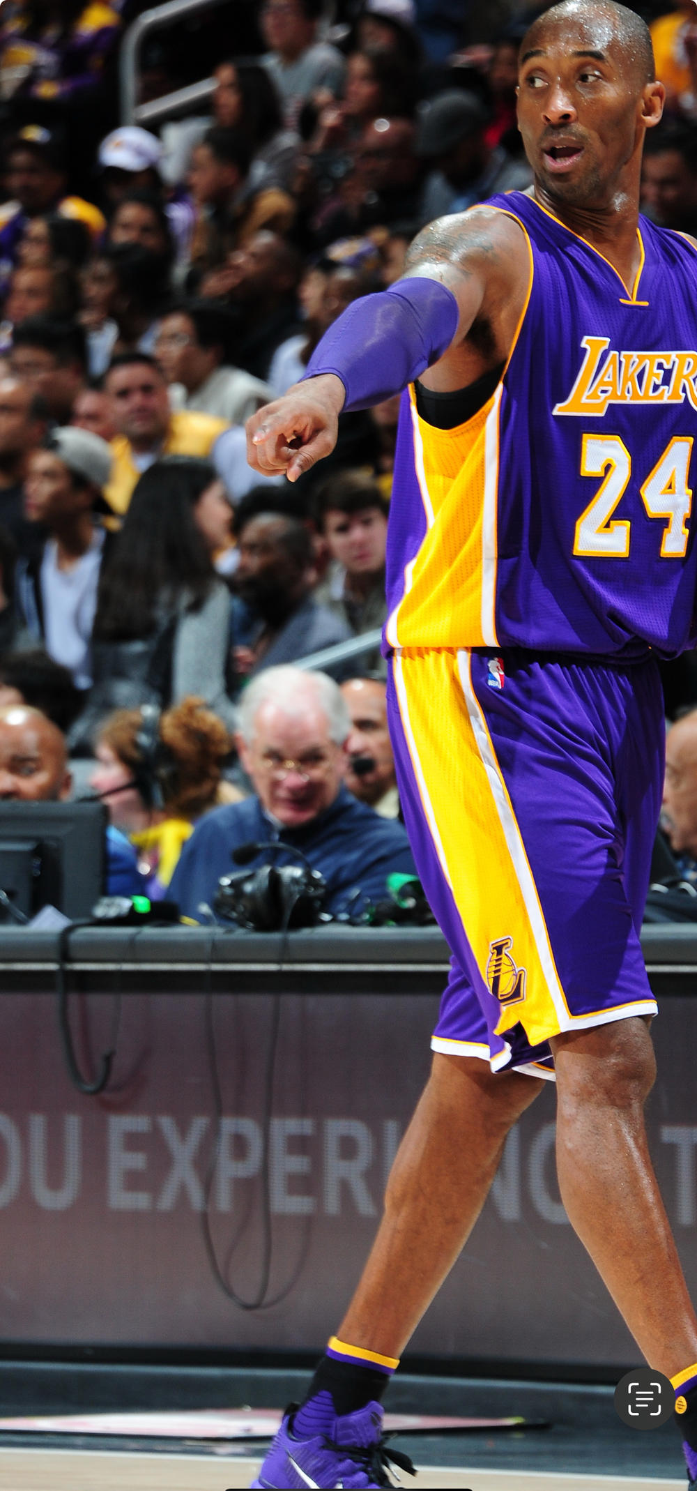 Kobe Bryant with John Darnall pictured in the background