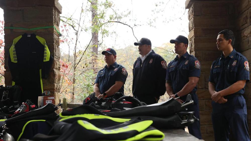 Members of the Macon-Bibb County Fire Department dive team stand near new scuba gear for the Bibb County Sheriff’s Office during a press conference on Tuesday, Dec. 10, 2024, at Amerson River Park in Macon, Georgia. The Bibb County Sheriff’s Office announced acquiring new scuba equipment that they will lend out to Macon-Bibb County Fire Department dive team to help in water emergencies. The money for the equipment was raised by the Macon-Bibb Law Enforcement Foundation. Katie Tucker/The Telegraph