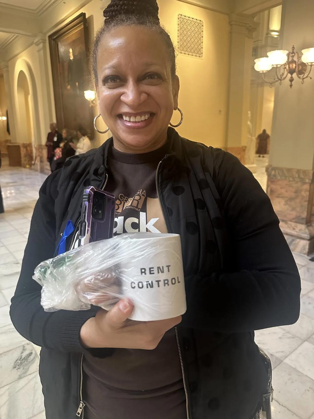 A supporter (above) of the Georgia Black Women’s Roundtable shows off her “rent Control” mug inside the Georgia State Capitol on Monday morning, the first day of the 2025 legislative session. Photo by Donnell Suggs/The Atlanta Voice