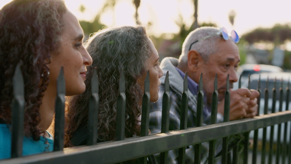 The Laws family outside of their old home.