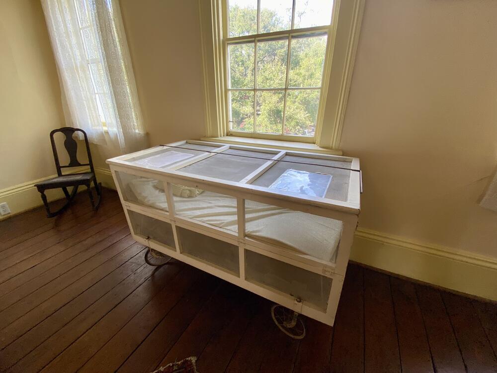 A 1920s "Kiddie Koop" served as O'Connor's baby crib. The design featured netting to protect against mosquitos, as yellow fever was a public health concern at the time.