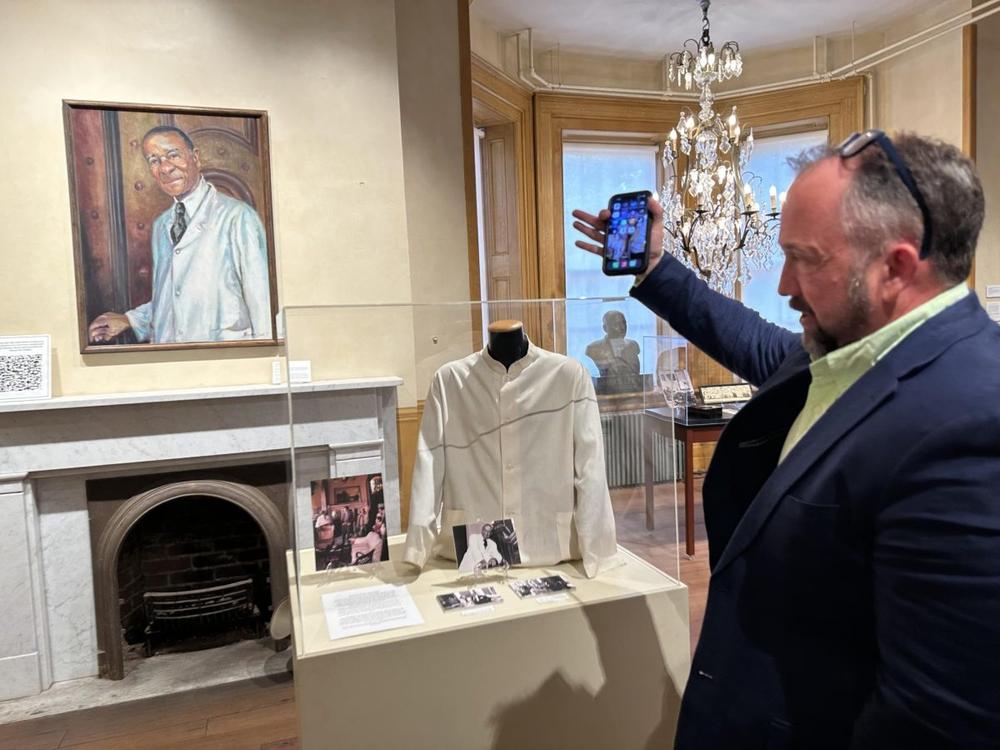 Hay House executive director Aubrey Newby explains the role of Chester Davis as the first tour guide and docent of the historic home in Macon. 