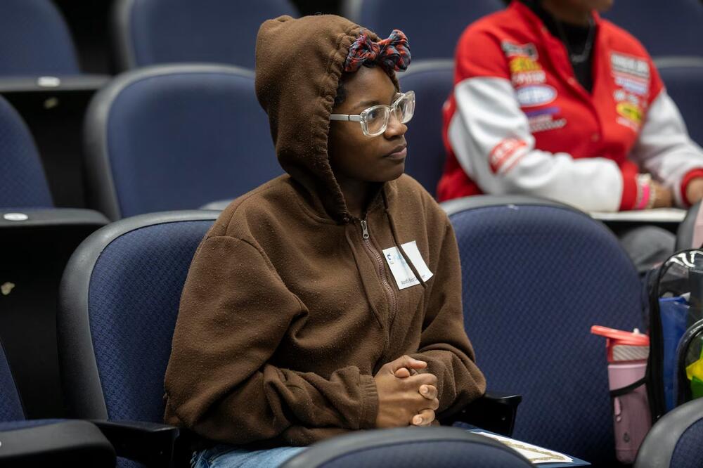 Charles Drew High School freshman Mariyah Carson listens to speakers during the Young, Gifted and Caregiving inaugural class at Charles Drew High School in Riverdale, Georgia, March 12.  (Alyssa Pointer for Healthbeat) 