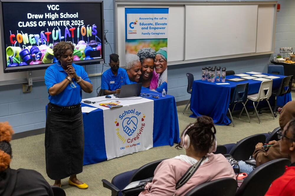 Michelle Bolden, founder of Call for Caring Inc., congratulates students for completing her inaugural Young, Gifted and Caregiving class at Charles Drew High School in Riverdale, Georgia, March 12.  (Alyssa Pointer for Healthbeat) 