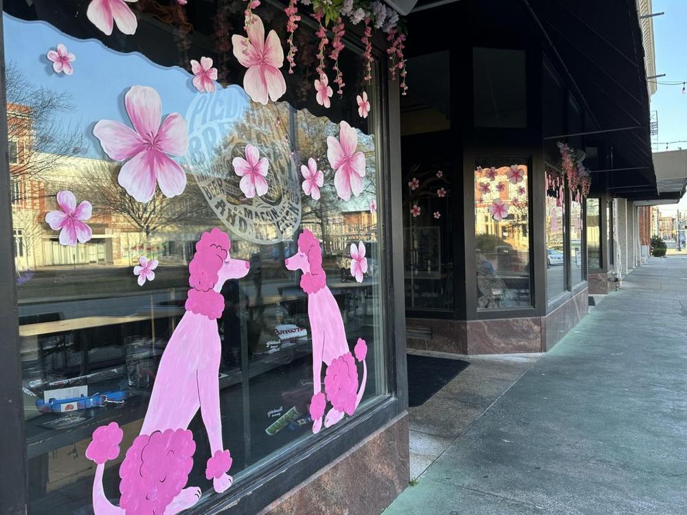 Piedmont Brewery and Kitchen painted its windows on Third Street with pink poodles, blossoms and skulls. (Liz Fabian)
