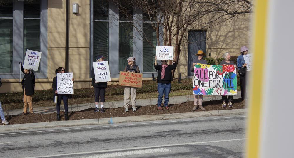 A demonstration at the Atlanta-based Centers for Disease Control and Prevention headquarters on Feb. 18, 2025, saw retired public health workers and others join to support current CDC employees as they left work to go home. Thousands have been terminated from agencies under the Department of Health and Human Services in recent days — a move that could threaten disease response.