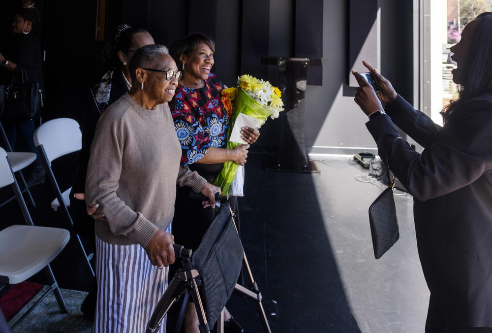 Zelma Redding, left, and her daughter Karla Redding-Andrews pose for a photo after the ribbon cutting at Macon's Otis Redding Center for the Arts. 