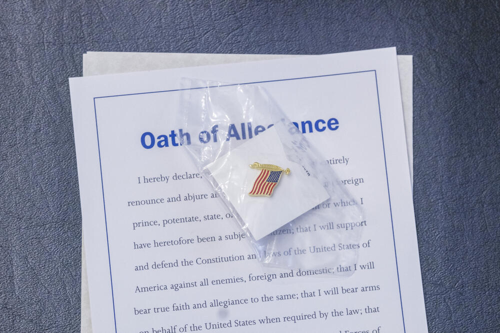 Every participant received a paper copy of the Oath of Allegiance and, as a memento, a small enameled pin of an American flag. 