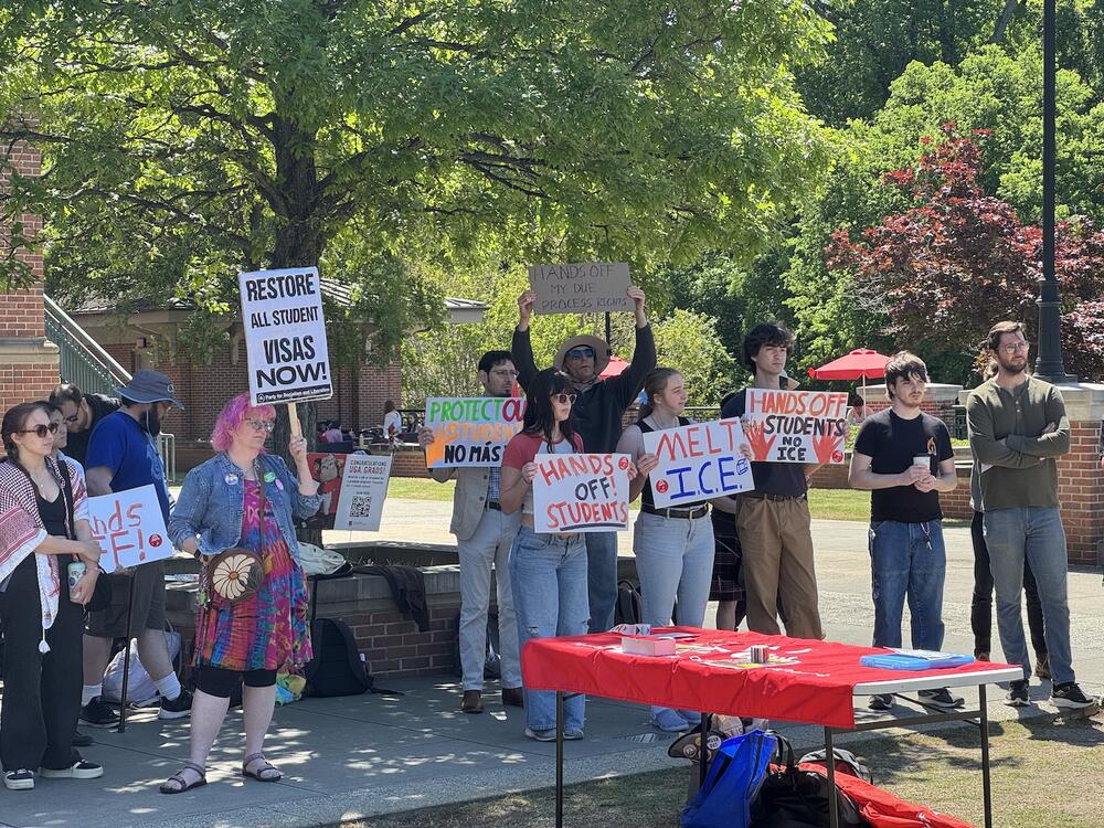 Protesters gather outside of Tate Student Center at the University of Georgia on April 16, 2025. Speakers at the rally called for an end to visa terminations for international students.