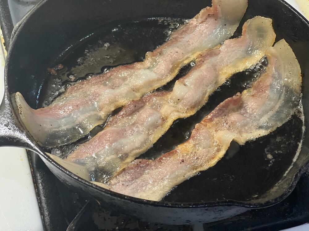 Chuck cooking Benton's Bacon in his home kitchen