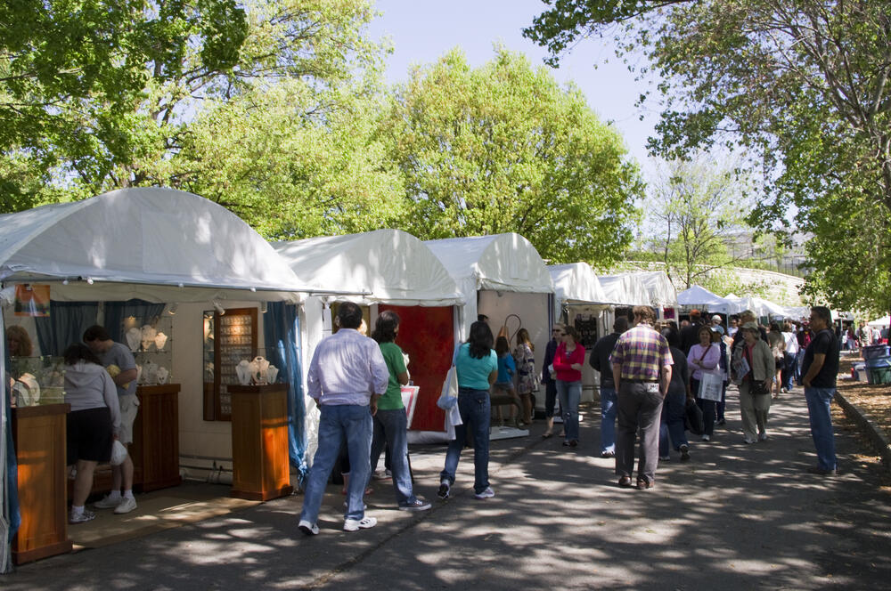 Attendees visit art booths at the Atlanta Dogwood Festival