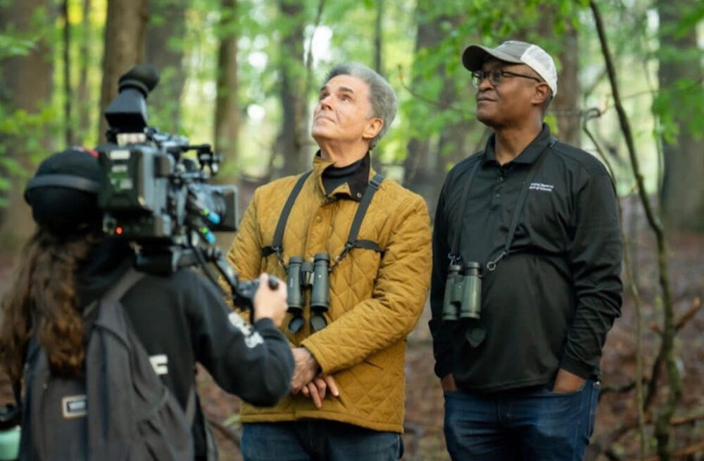 GPB's Jeff Hullinger and President and CEO of the Federal Reserve Bank of Atlanta, Dr. Raphael Bostic watch for birds in Cobb County.