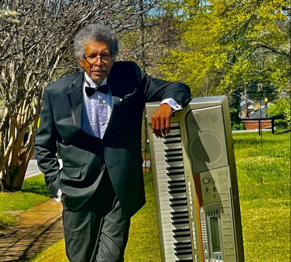 Graham Jackson Jr. poses with his piano.