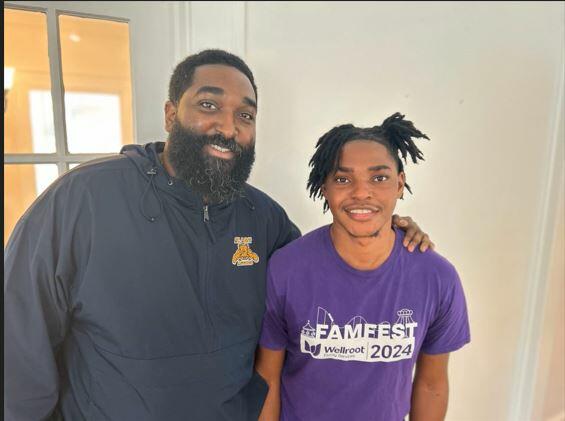 Life coach Ryan Mack (left) and former foster child Anwar Hogan pose for a photo