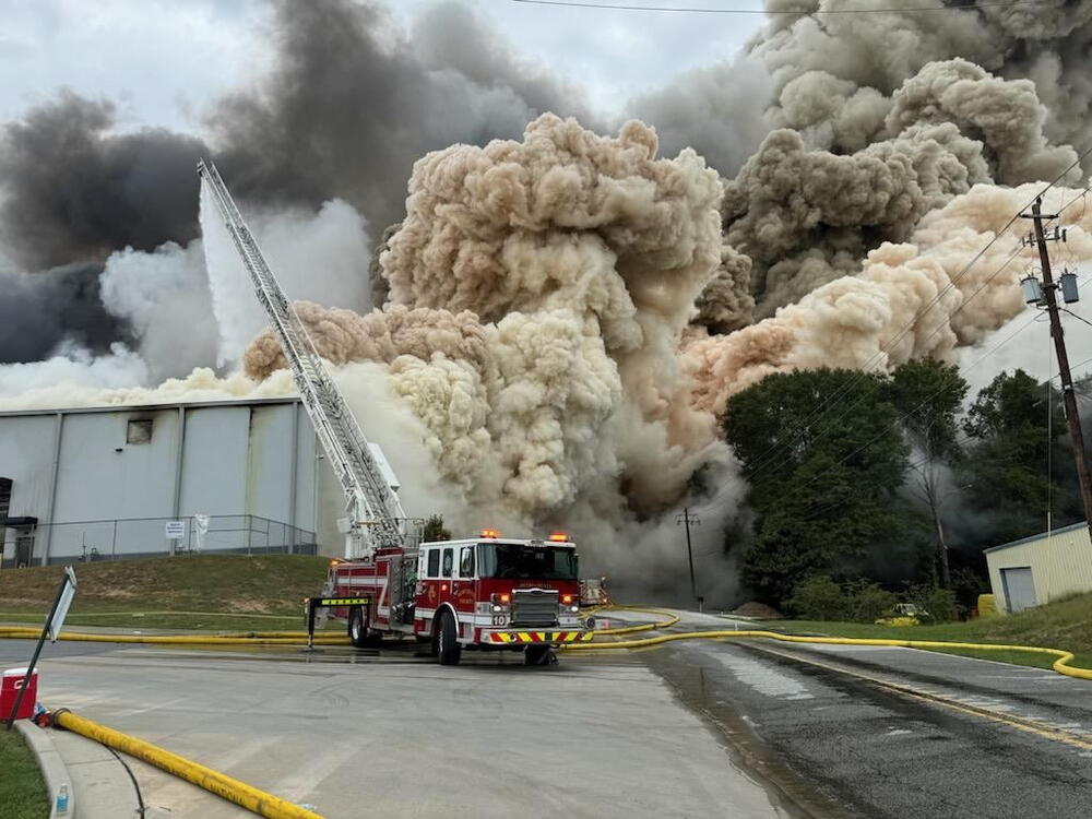 A chemical plume and heavy smoke rise from the BioLab facility in Conyers, Georgia, as firefighters respond to a chemical fire on September 29, 2024.