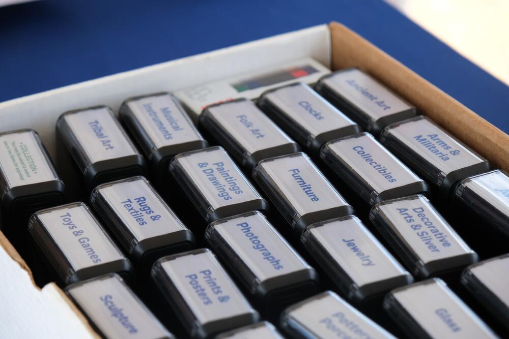 Volunteers at the triage tent stamped guests' appraisal cards with one of 23 different labels, corresponding to the category of best fit for each item.