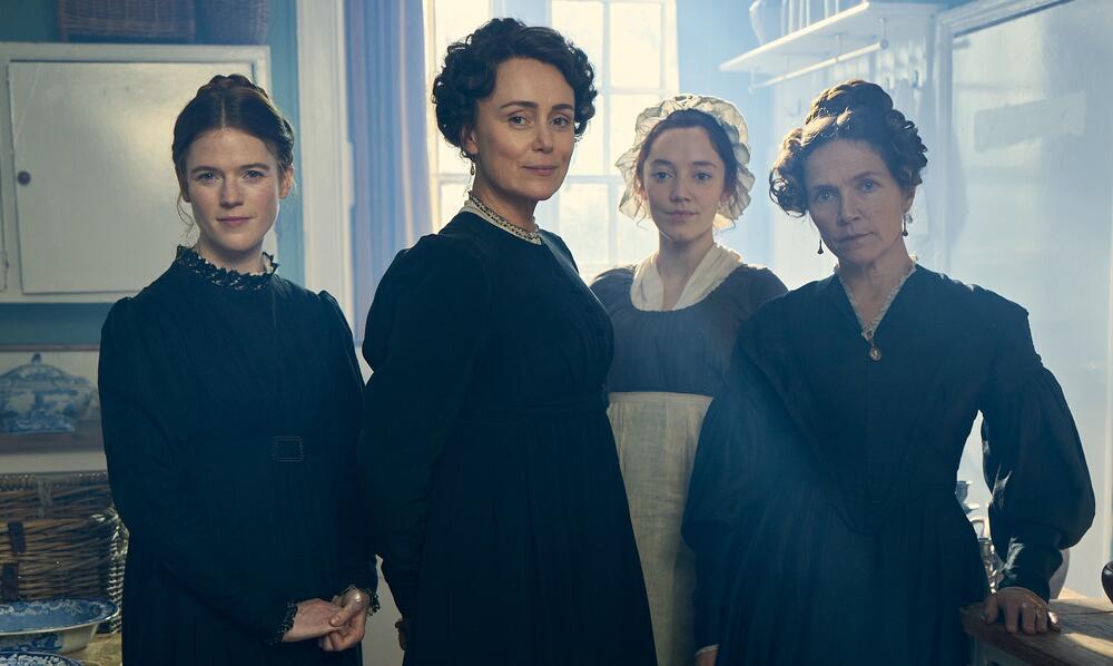 Four women in period dress.