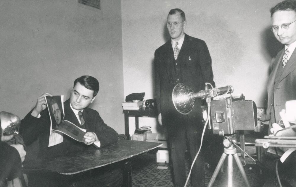 Edwin Land demonstrating the Land Camera for the Optical Society of America. April 1947.