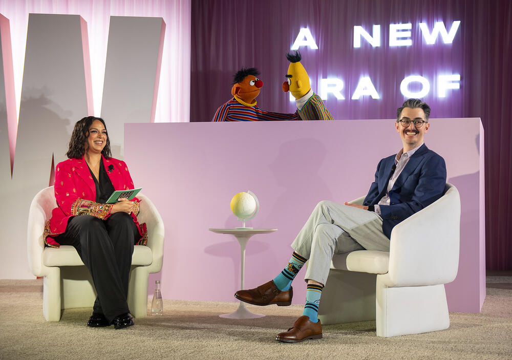 Sal Perez, executive producer and VP of Sesame Street at Sesame Workshop, right, and Versha Sharma, editor-in-chief at Teen Vogue, talk to Burt and Ernie after Sesame Workshop won the Elevate Prize Foundation's Catalyst Award, Wednesday, May 14, 2025, in Miami Beach, Fla.