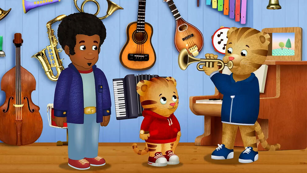 Dad Tiger plays the trumpet for Daniel and Music Man Stan