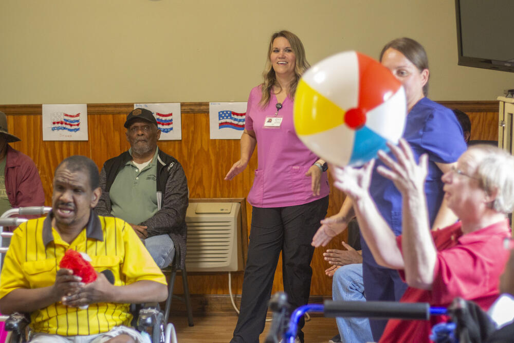 Nurse Chrisy Anderson, center, leads a ball toss at Homeplace Adult Day Center in Wrens, G.a., one of several activities at the center aimed at sharpening the mobility of its elderly and disabled clients.