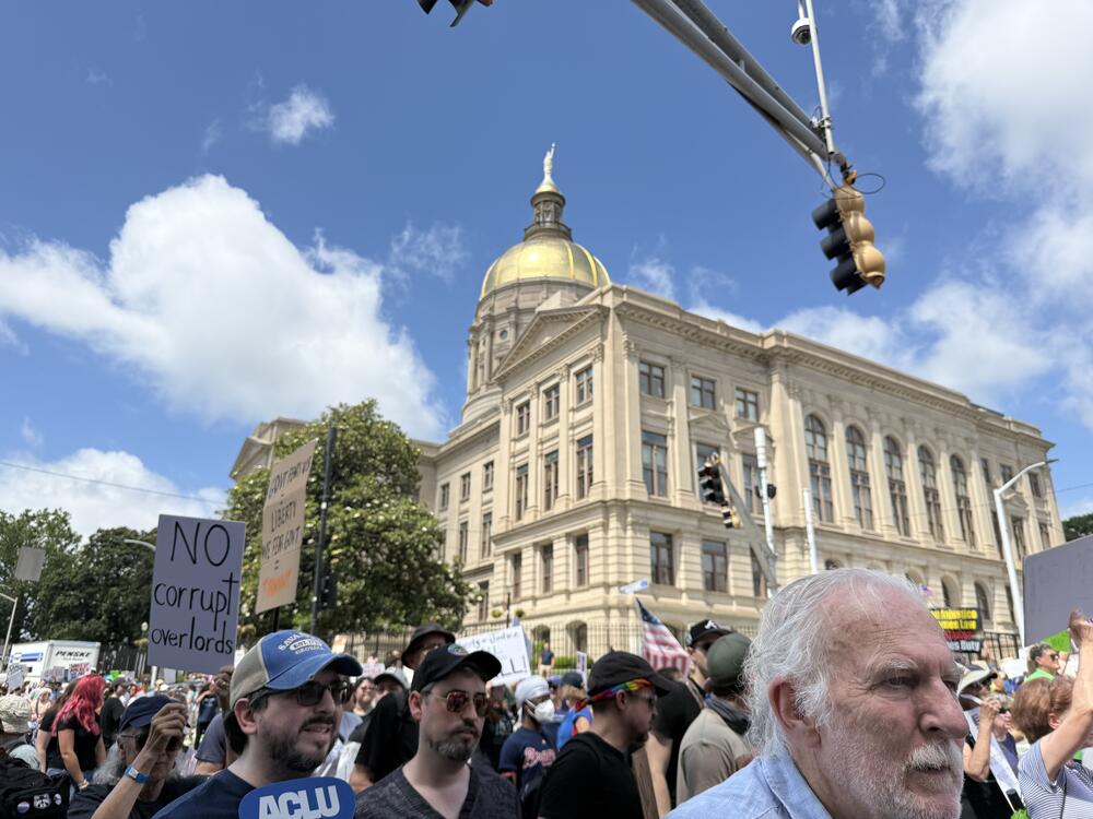 No Kings protestors demonstrate outside the Georgia state Capitol in Atlanta on June 14, 2025. Abisola Dahunsi/GPB News
