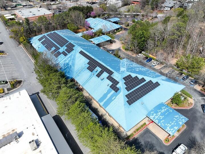 solar panels on top of a large blue roof