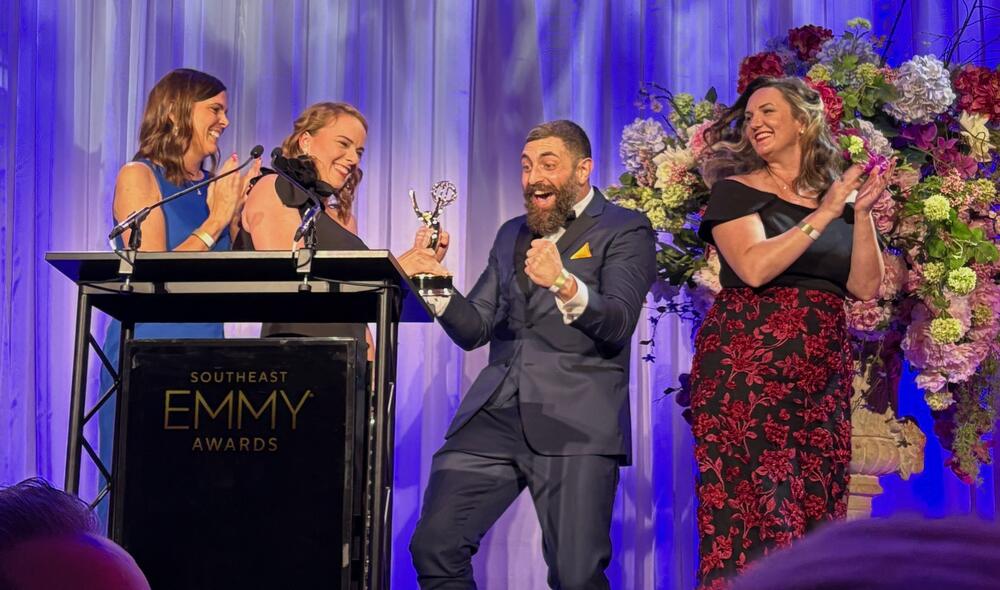 Winners accepting the Emmy.