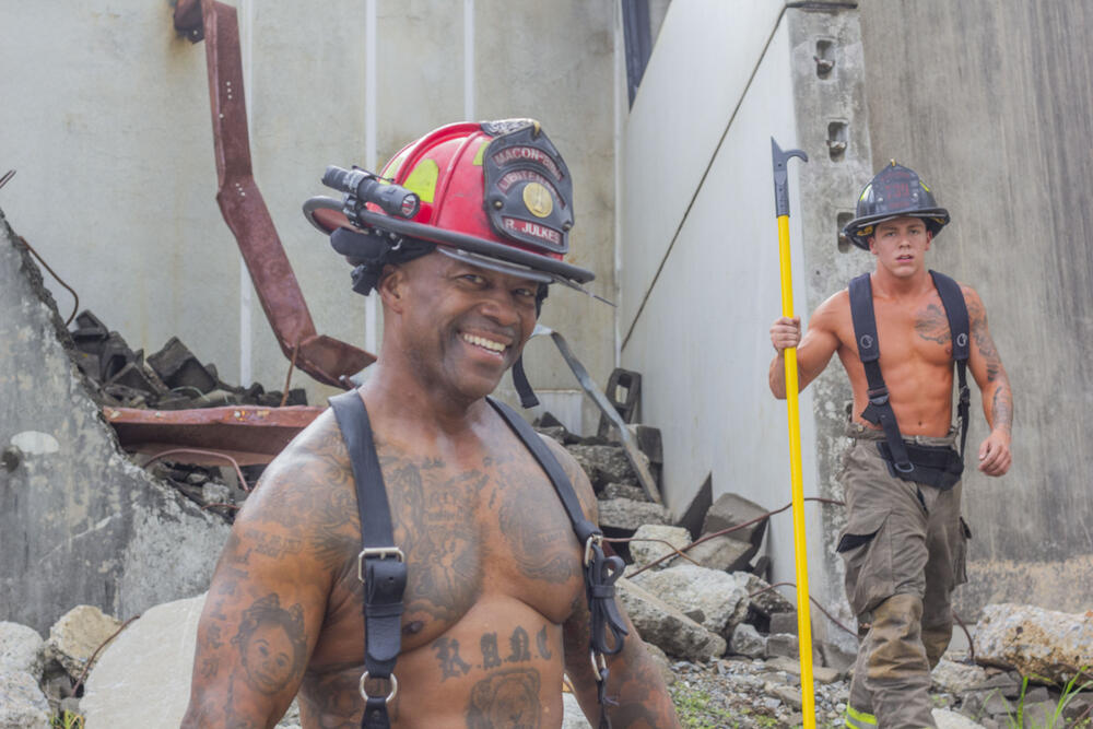 Firefighters Roberto Jose Julkes and Michael White  at a photoshoot on June 4, 2025 for the Middle Georgia Firefighter Calendar.