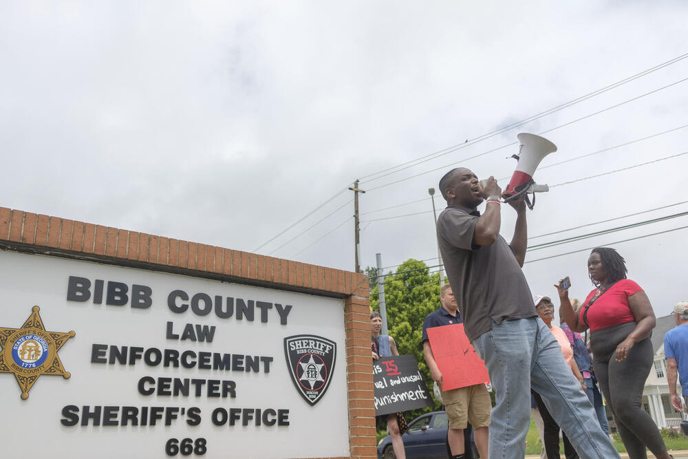 Brian Randolph of the Human and Civil Rights Coalition of Georgia organized and led the protest at the Bibb County Jail. His Facebook page which typically publishes leaked cellphone video from inside Georgia prisons recently published photos from inside the Bibb County Jail. 