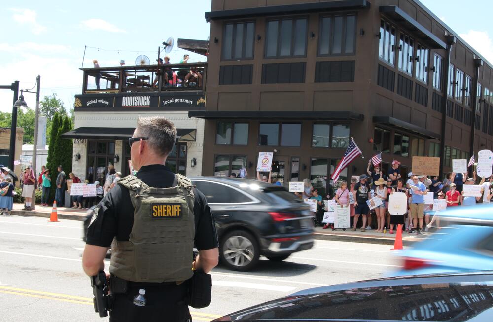 Cherokee County Sheriff Frank Reynolds watches the crowd during the June 14 "No Kings" protest in Downtown Woodstock.