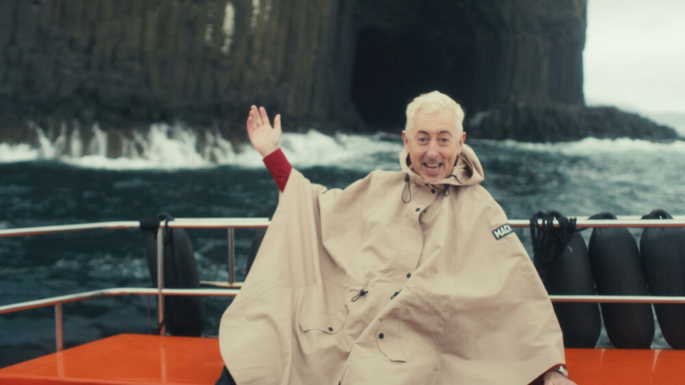Alan Cummings on a boat.