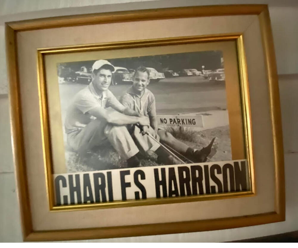 Charles Harrison smiles for a photo while on the golf course.