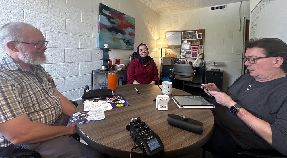 Chuck (right) talks with Senior Director of Program Integration, Rusty Pritchard (left) and Coalition of Refugee Service Agencies director, Muzhda Oriakhil (center) at Friends of Refugees headquarters in Clarkston, GA.