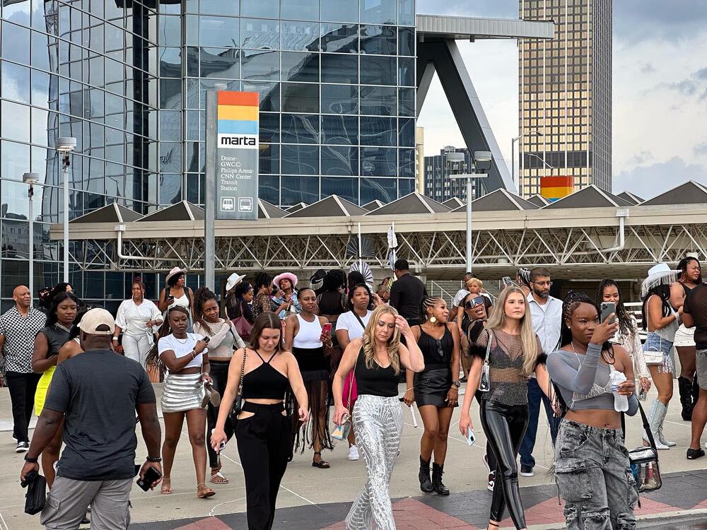 Beyoncé fans leave Mercedes-Benz Stadium in western wear and a MARTA transit sign is visible in the back