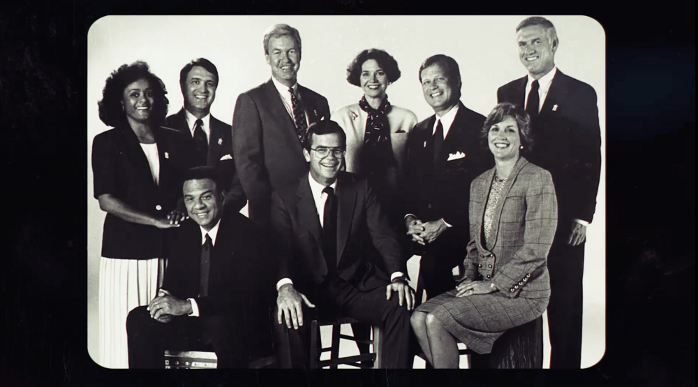 Nine people pose for a photo: The Atlanta Nine