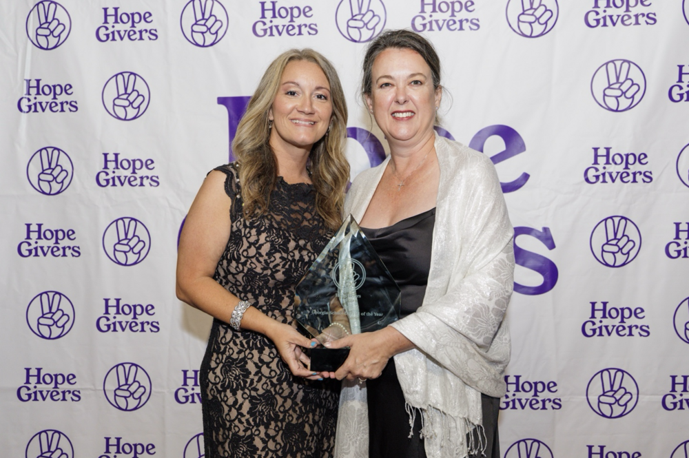 Shana Backus and Joy Carr accept the Georgia School District of the Year Award for Jones County School System