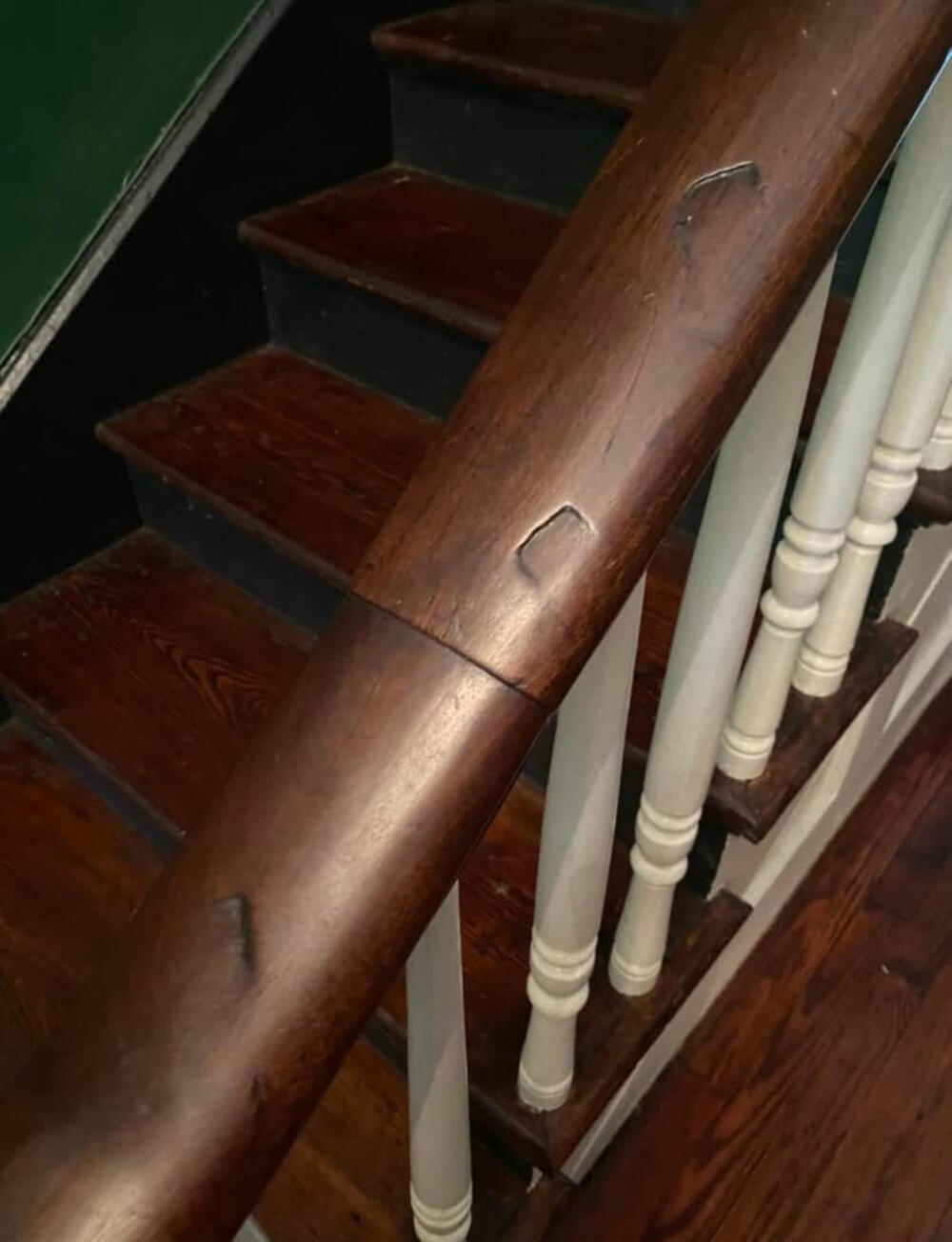 The staircase of the Harrison home with indentations from occupying Union soldiers rifle butts.