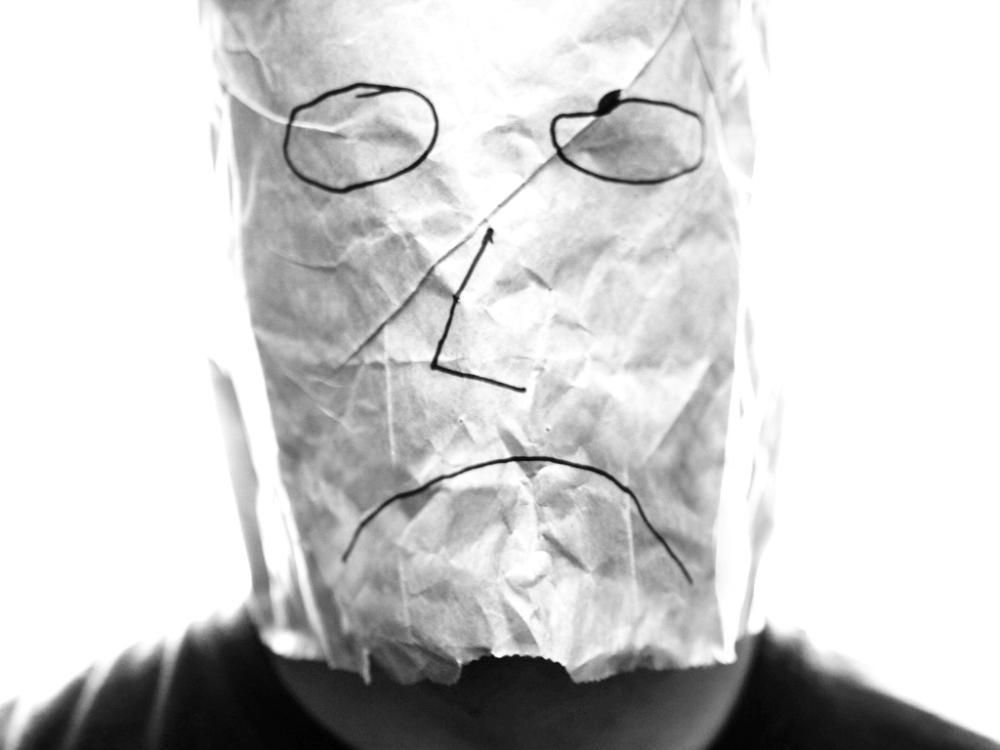 (Photo Courtesy of <a href=http://upload.wikimedia.org/wikipedia/commons/0/0d/Gray_paper_bag_with_sad_smiley_over_head.jpg>Saibo