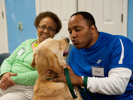 Bryson Casey with his dog Wagner during a training session at Canine Assistants. Photo courtesy of David Scott. Bryson Casey with his dog Wagner during a training session at Canine Assistants. Photo courtesy of David Scott.