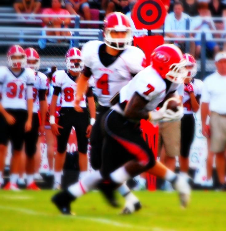 North Gwinnett QB Hayden Sphire hands off to RB CJ Leggett