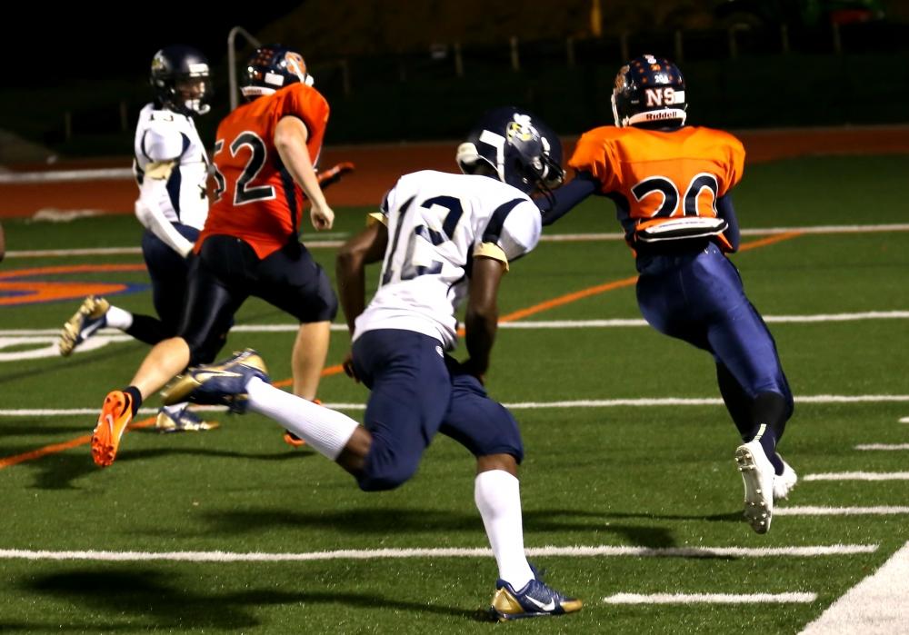 North Springs' Fabian Lumpkin returns an interception to score with 1:30 left to seal a Spartan victory. Photo by: David King