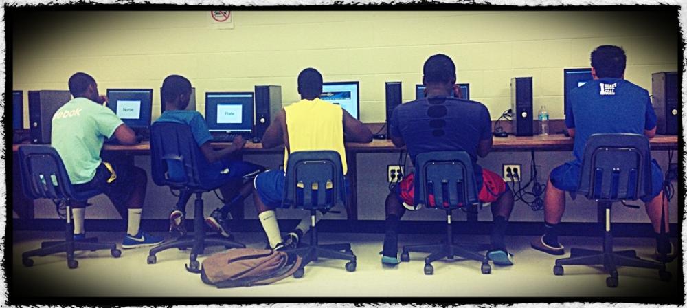 Chattahoochee High School football players take the baseline test on computers