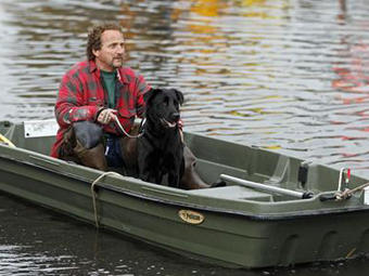 Ray Cilli and his dog Woubie are rescued from flood waters brought on by Hurricane Sandy in Little Ferry, New Jersey.