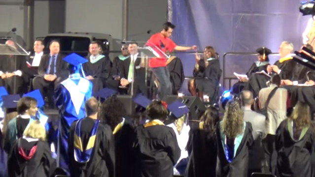 Parker Pitisci dances across his graduation stage.