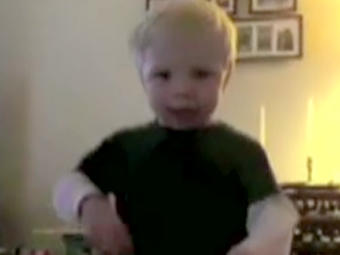 A screenshot of Spencer's winning Curious George Dance contest moves.