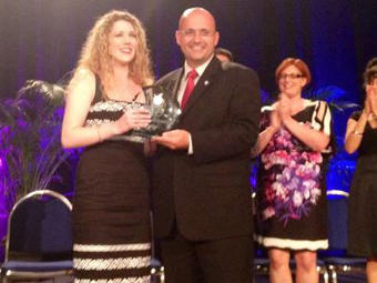 Lauren Eckman (left) receives the Georgia Teacher of the Year award from Superintendent John Barge (Courtesy facebook.com/gadoe