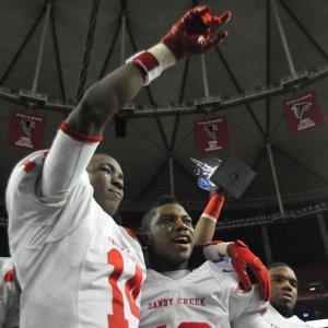 Photo special to GPB. Alex Chisum (L) and Ronnie Bell (R) celebrate after Sandy Creek's state final win over Carrollton.